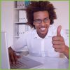 Thumbs Up Young Man Behind Laptop
